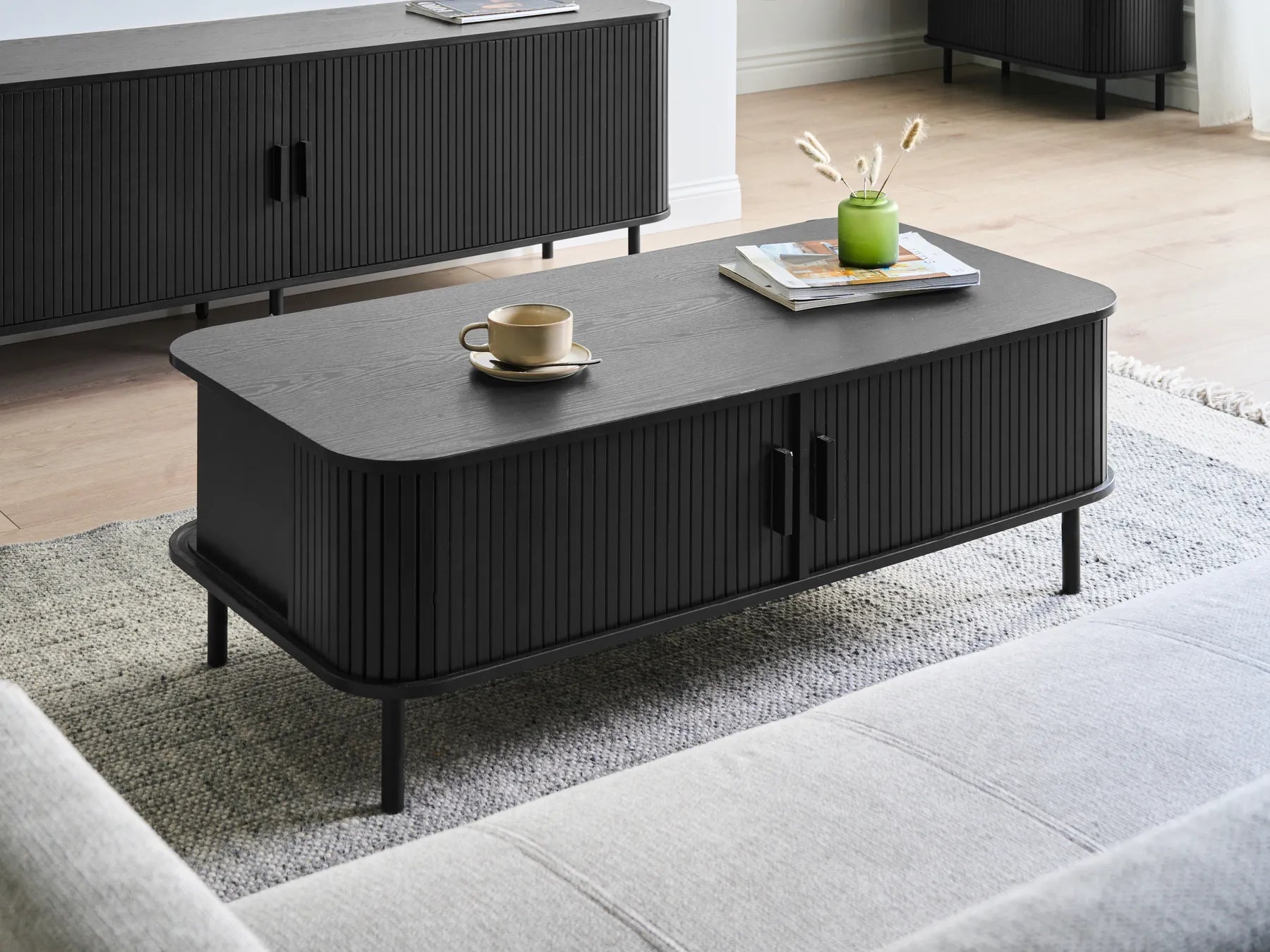 BRADLEY Black Coffee Table with Sliding Doors, MDF Wood, Rectangular Storage Table 120×60×41 cm