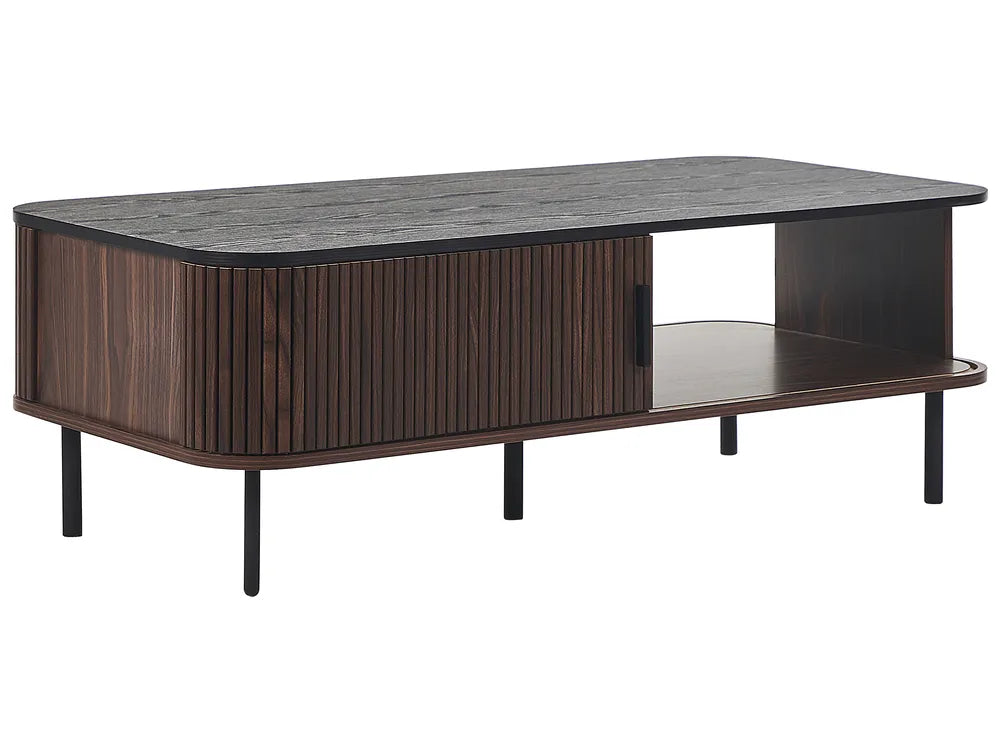 The JOSE dark brown coffee table is a rectangular coffee table with built-in storage, designed for modern living rooms. It features sliding doors that provide easy access to concealed storage compartments, as well as two open shelves for everyday items.