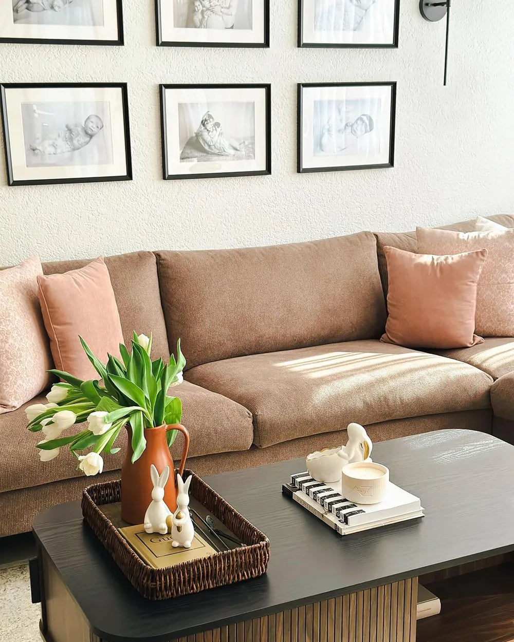 The JOSE dark brown coffee table is a rectangular coffee table with built-in storage, designed for modern living rooms. It features sliding doors that provide easy access to concealed storage compartments, as well as two open shelves for everyday items.